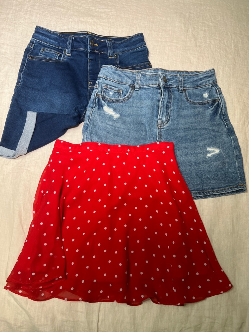 Girls denim skirt and shorts and red Polk a dot skirt